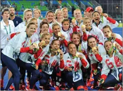  ??  ?? GIRL POWER: Team GB’s triumphant players show off their medals