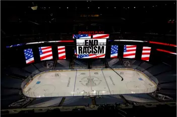  ?? Jason Franson/The Canadian Press via AP ?? An End Racism sign is displayed before Game 3 of an NHL hockey second-round playoff series between the Colorado Avalanche and the Dallas Stars, on Aug. 26 in Edmonton, Alberta.