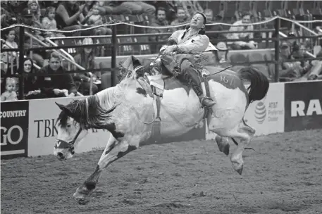  ?? Hyoung Chang, The Denver Post ?? Bill Tutor of Huntsville, Texas, competes Thursday in bareback riding at the National Western Stock Show’s sensory-friendly rodeo at the Denver Coliseum. The stock show’s 16-day run wraps up Sunday.