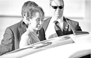 ?? — AFP photo ?? San Suu Kyi arrives at the Fairbairn Defence Establishm­ent in Canberra.
