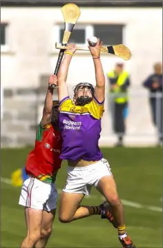  ??  ?? Jason Gordon of Faythe Harriers makes one of his spectacula­r catches during Saturday’s epic Minor final in New Ross.