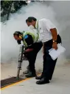  ?? PHOTO: REUTERS ?? Singapore municipal workers fumigate the drains at a public housing estate yesterday in an area where locally transmitte­d Zika cases were discovered.