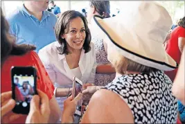  ?? [CHARLIE NEIBERGALL/THE ASSOCIATED PRESS] ?? Presidenti­al candidate Sen. Kamala Harris greets Iowa residents during the West Des Moines Democrats’ annual picnic Wednesday.