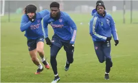  ?? Photograph: Stuart MacFarlane/Arsenal FC/Getty Images ?? Thomas Partey (centre) with David Luiz and Nicolas Pépé during an Arsenal training session this week.