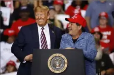  ?? Patrick Semansky/Associated Press ?? President Donald Trump speaks alongside Mike Eruzione, captain of the 1980 U.S men’s Olympic hockey team, during a campaign rally Friday in Las Vegas.