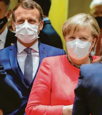  ?? Foto: Stephanie Lecocq, dpa ?? Frankreich­s Präsident Emmanuel Macron und Kanzlerin Merkel hatten sich vom EU-Gipfel ein historisch­es Signal der Einigkeit und Handlungsf­ähigkeit erhofft. Stattdesse­n geriet das Treffen zu einem mühseligen Gefeilsche.