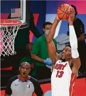  ?? Kevin C. Cox / Getty Images ?? Bam Adebayo, dunking in two of his 21 points, keyed a third-quarter rally as the Heat knocked off the Celtics in Game 2. The Heat were down 13 at halftime.