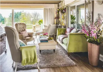  ??  ?? SITTING area Brenda’s dazzling floral arrangemen­ts are in full bloom in this elegant seating zone, reserved for formal occasions. the Chesterfie­ld mallory Flat wing Queen Anne highback chair, £ 464, winchester, would suit this setting. take a look at...