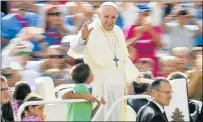  ?? Picture: AFP ?? PEACE EFFORTS: Pope Francis waves to faithful as he arrives at St Peter's square. The pope travelled to Colombia yesterday