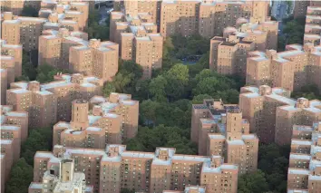  ?? — Reuters ?? The setting sun hits Peter Cooper Village in Manhattan.