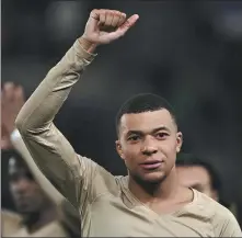  ?? *AFP ?? Paris Saint-Germain’s French forward Kylian Mbappe celebrates his team's victory at the end of a French Ligue 1 match against Strasbourg at the Meinau stadium in France on Friday.