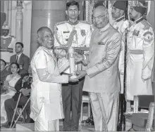  ??  ?? President Ram Nath Kovind confers Padma Vibhushan on Music Director Ilaiyaraaj­a during the Padma Awards 2018 function at Rashtrapat­i Bhavan on Tuesday.