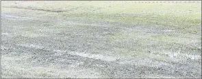  ?? ?? The muddy Prince of Wales Sports Ground during the Vovovo FC and Mbabane Highlander­s game.