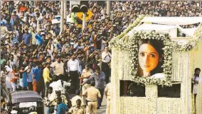  ??  ?? The body of Bollywood actress Sridevi is carried in a truck during her funeral procession in Mumbai on Wednesday