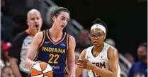  ?? DARRON CUMMINGS / AP ?? Indiana Fever guard Caitlin Clark (left) drives on Atlanta Dream guard Allisha Gray (right) during the first half of a preseason game Thursday. Clark was the top pick in the WNBA draft.