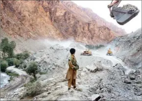  ?? MAURICIO LIMA/THE NEW YORK TIMES ?? Road constructi­on is seen near an iron ore mine in Bamiyan, Afghanista­n, on July 4, 2012.