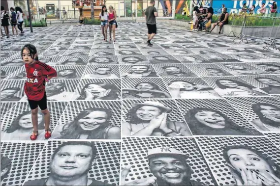  ?? Photos: Chris McGrath/Getty Images ?? Street art: Many of Rio’s artistic offerings during the Olympics unfolded in its public spaces, such as the portraits produced by French artist JR for his InsideOut project (above), as well as other installati­ons across the city such as a high jumper...