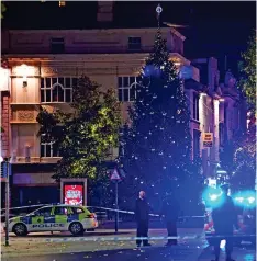  ?? ?? Sealed off: Police guard a cordon at the crime scene