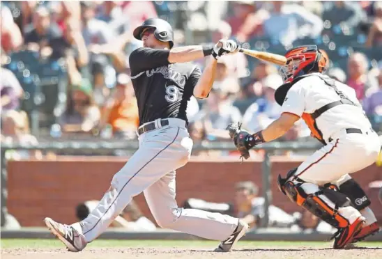  ?? Ezra Shaw, Getty Images ?? Rockies second baseman DJ LeMahieu hits a two-run homer in the ninth inning against the Giants at AT&amp;T Park in San Francisco on June 28. LeMahieu’s home run has helped spark an impressive run by Colorado, which is 13-3 in its past 16 games.