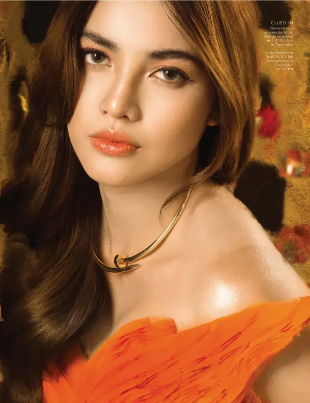  ??  ?? CLUED IN Shimmer makeup and glossy lips further highlight the gleam of the CARTIER Juste un Clou necklace
Orange pleateddre­ss by MARC RANCY, 18K yellow gold Juste un Clou necklace by CARTIER