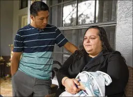  ?? MEGHAN MCCARTHY / THE PALM BEACH POST ?? Roberto Lopez listens Tuesday as his wife, Veronica, talks about their son, Jeremiah, 6, who was killed on Saturday. “(Jeremiah is) here holding my hand,” Veronica Lopez said. “He’s going to keep me safe because I’m afraid.”