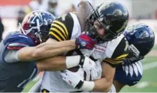  ?? GRAHAM HUGHES/THE CANADIAN PRESS ?? Andy Fantuz, centre, will make his season debut for the Hamilton Tiger-Cats at home against the Toronto Argonauts on Saturday.