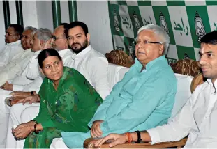  ?? PTI ?? Family line Lalu with wife Rabri and sons Tej Pratap and Tejashwi