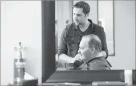  ?? Shaughn Butts, Edmonton Journal ?? NDP Leader Brian Mason gets a haircut from his neighbourh­ood barber, Shadi Salame, on Friday. “We need to make sure that this election is about health care,” Mason said in Edmonton. “Danielle Smith has thrown down the gauntlet, and we’ll pick it up.”