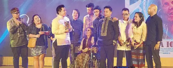 ?? — Photos courtesy of FDCP ?? Eduardo Roy Jr.’s Lola Igna wins four awards, including Best Picture and Best Actress for its 82-year-old lead star Angie Ferro (left photo) at the Gabi ng Parangal of the 2019 Pista ng Pelikulang Pilipino (PPP)