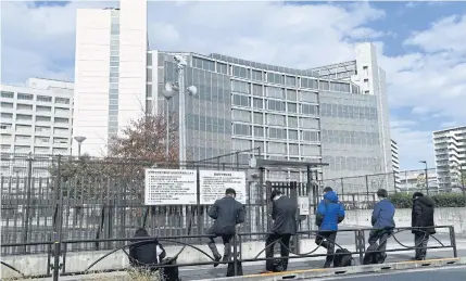  ?? AFP ?? Journalist­s wait outside the Tokyo Detention House in Katsushika, where Carlos Ghosn, one of the world’s most influentia­l car executives, is believed to be held.