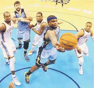  ??  ?? Zach Randolph (front) of the Memphis Grizzlies goes for a rebound against the Oklahoma City Thunder in Game Two of the Western Conference Quarterfin­als during the NBA Playoffs at Chesapeake Energy Arena in Oklahoma City, Oklahoma. — AFP photo