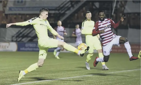  ??  ?? 2 Hibs striker Oli Shaw stretches out his right foot to score the only goal of the game against Hamilton on Saturday, ending a run of seven games without a win.