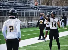  ?? (Pine Bluff
Commercial/I.C. Murrell) ?? Joshua Hart and Donald Richardson of UAPB warm up their arms before the start of preseason camp Friday at Simmons Bank Field in Pine Bluff. Hart transferre­d from Arizona State, and Richardson is a newcomer from Arkansas State.