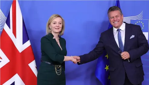  ?? ?? uropean Commission­er for Inter-institutio­nal Relations and Foresight Maros Sefcovic, right, greets British Foreign Secretary Liz Truss, in Brussels, Monday, Feb. 21, 2022.