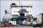  ?? (AP/Peter Morrison) ?? Freight lorries and cars board the P&O ferry Monday at Larne Port,
Northern Ireland.