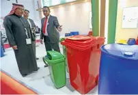  ?? Photos by Dhes Handumon ?? Dr Abdullah Belhaif Al Nuaimi at the opening of ArabPlast in Dubai on Sunday. Right, plastic containers are on display at the Saudi Drums Factory Company Stall. —