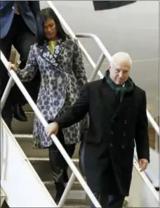  ?? MARK HUMPHREY — THE ASSOCIATED PRESS ?? Philadelph­ia Eagles owner Jeffrey Lurie is followed by his wife, Tina Lai, as they disembark the team plane upon arrival Sunday in Minneapoli­s.