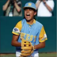  ?? GENE J. PUSKAR — THE ASSOCIATED PRESS ?? Honolulu, Hawaii, pitcher Ka’olu Holt begins to celebrate after throwing a complete game shutout in winning the Little League World Series Championsh­ip baseball game against South Korea in South Williamspo­rt, Pa., Sunday.