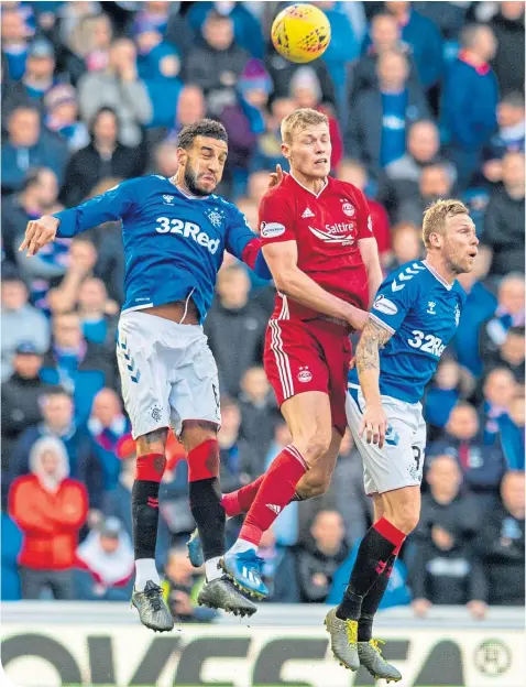  ??  ?? Air they go as Rangers’ Connor Goldson (left) and Don striker Sam Cosgrove battle it out