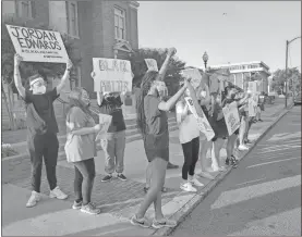  ?? John Bailey ?? A large group of people turned out on Broad Street on Tuesday evening as part of a pop up gathering to call for racial justice in America. People gathered peacefully and were greeted with waves and honking horns as those driving up and down Rome’s downtown showed support for the call.