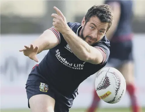  ??  ?? Scrum-half Greig Laidlaw passes the ball in training ahead of the Lions’ latest tour match against the Chiefs in Hamilton today.