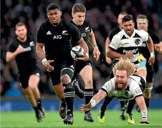  ?? PHOTO: GETTY IMAGES ?? Waisake Naholo, one of the All Blacks’ better players yesterday, evades the tackle of Willie Britz of Barbarians during the 31-22 win at Twickenham.