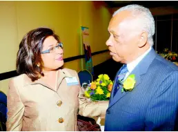  ??  ?? Jean Lowrie-Chin, guest speaker at the Gleaner’s pensioners’ luncheon, greets veteran sports journalist Tony Becca in March 2012.