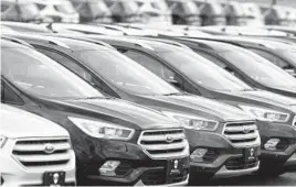  ?? DAVID ZALUBOWSKI/AP 2019 ?? Rows of Ford Escape SUVs sit on a Colorado dealership’s lot in Broomfield, a suburb of Denver. SUVs and trucks are the best-selling vehicles in the country.