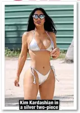  ?? ?? Kim Kardashian in a silver two-piece