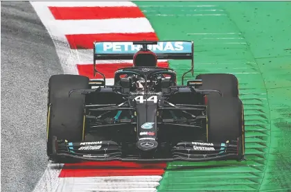  ?? JOE KLAMAR/AFP VIA GETTY IMAGES ?? Mercedes’ British driver Lewis Hamilton steers his car during the second practice session at the Austrian Formula One Grand Prix on Friday in Spielberg, Austria. Seven months after they last competed in earnest, F1 teams will open the 2020 season on Sunday.