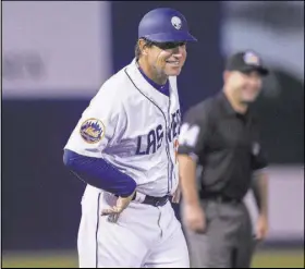  ?? Benjamin Hager Las Vegas Review-Journal @benjaminhp­hoto ?? First-year 51s manager Tony DeFrancesc­o signals to his batter during a Pacific Coast League game with the El Paso Chihuahuas on April 9 at Cashman Field. DeFrancesc­o says he’s a fan of a new minor league rule that puts a runner on second base to start...