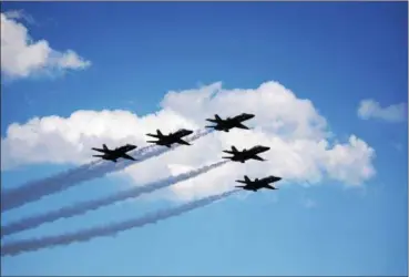  ?? PHOTO BY WILLIAM J. KEMBLE ?? The U.S. Navy Blue Angels soar during the New York Air Show at Stewart Internatio­nal Airport on Sunday.