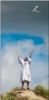  ?? SUBMITTED PHOTO ?? Jesus speaks to the heavens while a dove flies overhead in a scene from the Canadian Badlands Passion Play in Drumheller. The play runs from July 723.