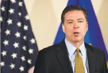  ?? Cliff Owen / Associated Press ?? FBI Director James Comey lays out the findings Tuesday.